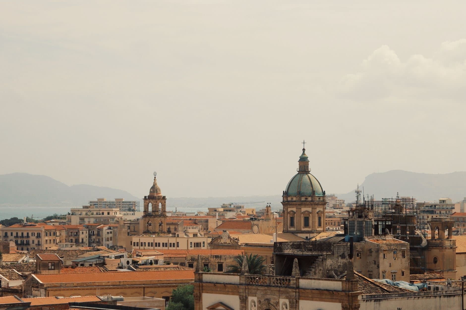 Aerial view of majestic domes amidst the vibrant cityscape of Palermo, Sicily, Italy.