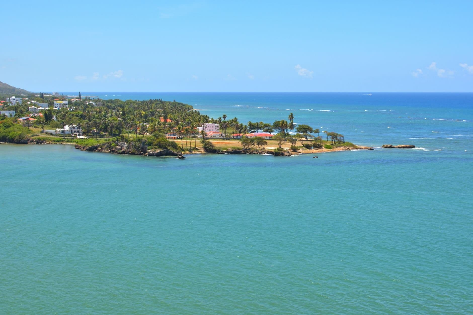 Stunning aerial view showcasing the turquoise waters and lush greenery of Puerto Plata, Dominican Republic.