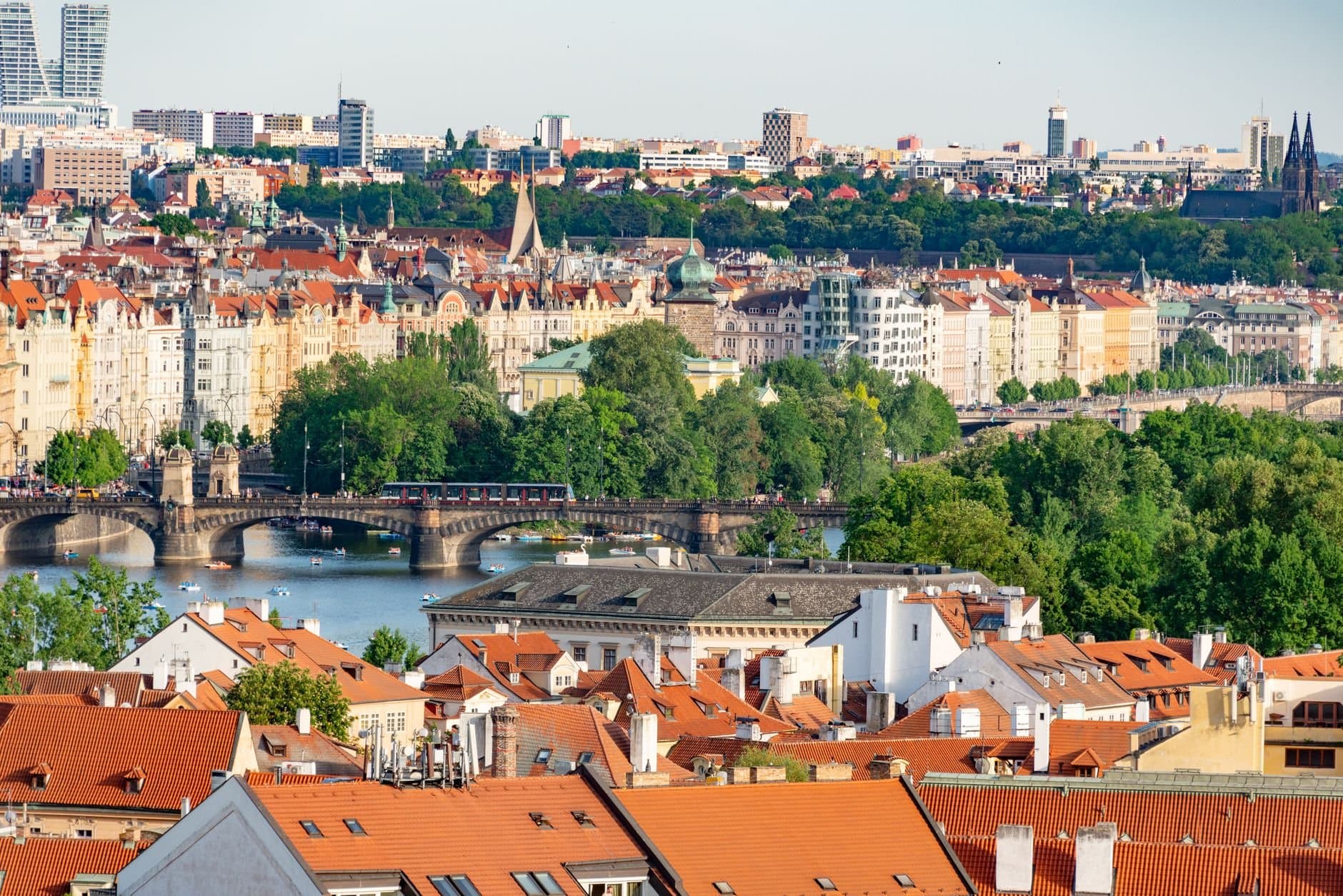 Explore the historic charm of Prague's bridges and architecture with this stunning aerial cityscape.