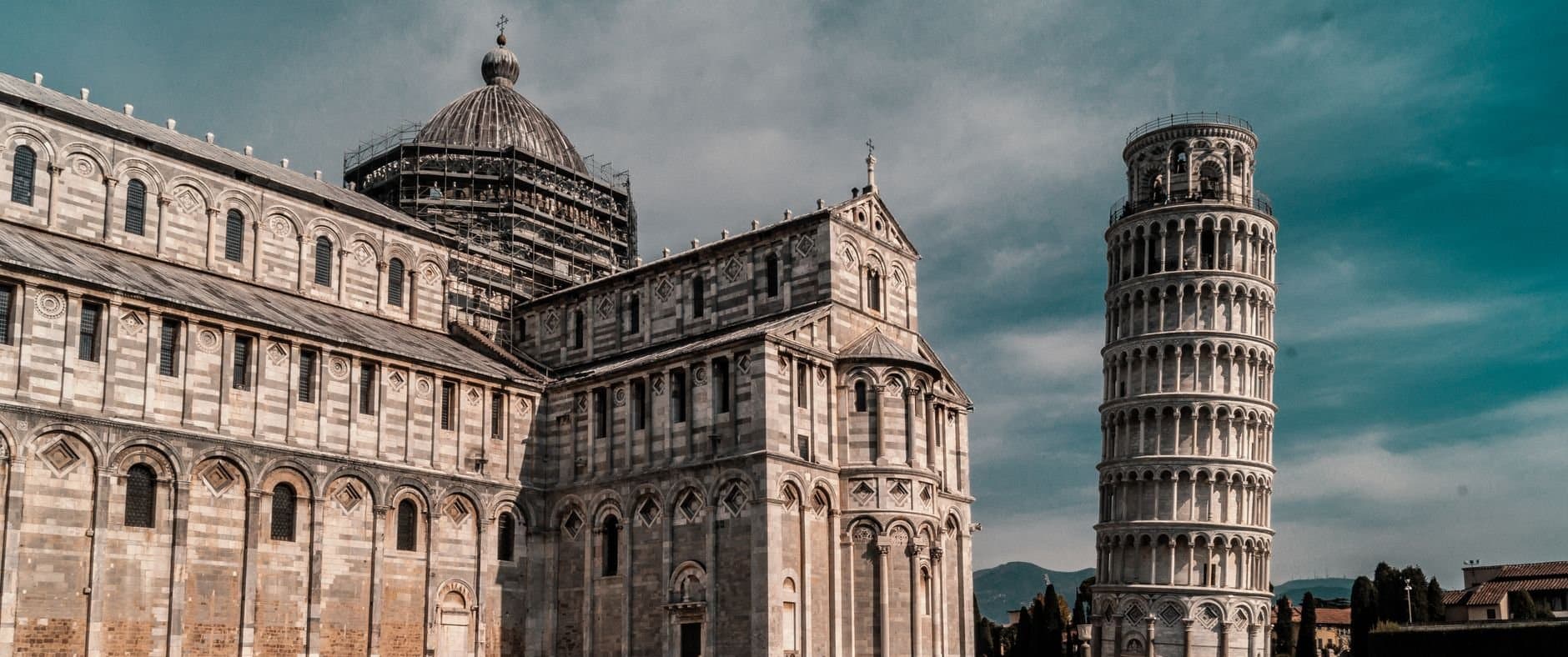 Beautiful view of the Leaning Tower and Pisa Cathedral in sunny Italy.