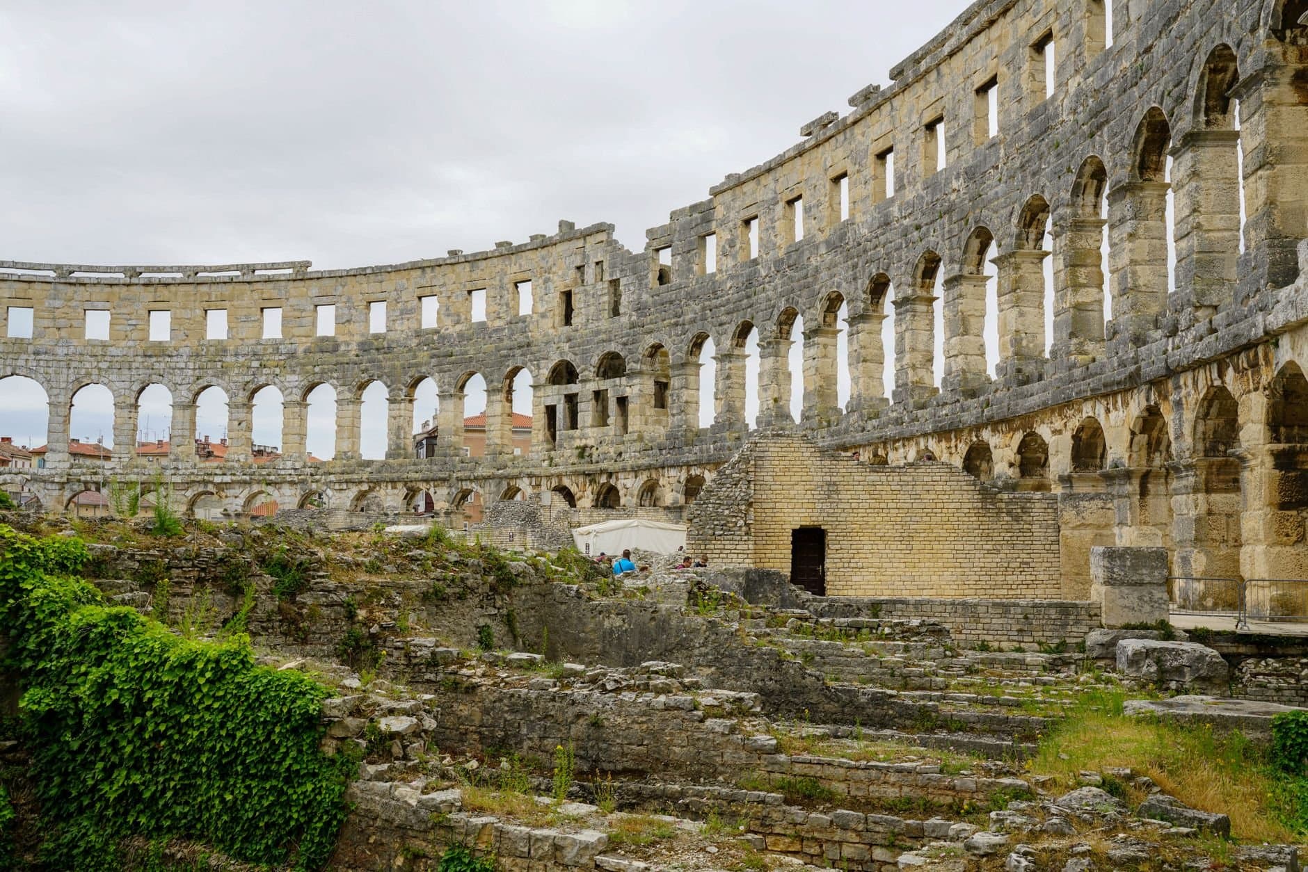 Explore the historic Roman amphitheater ruins in Pula, a major tourist attraction in Croatia.