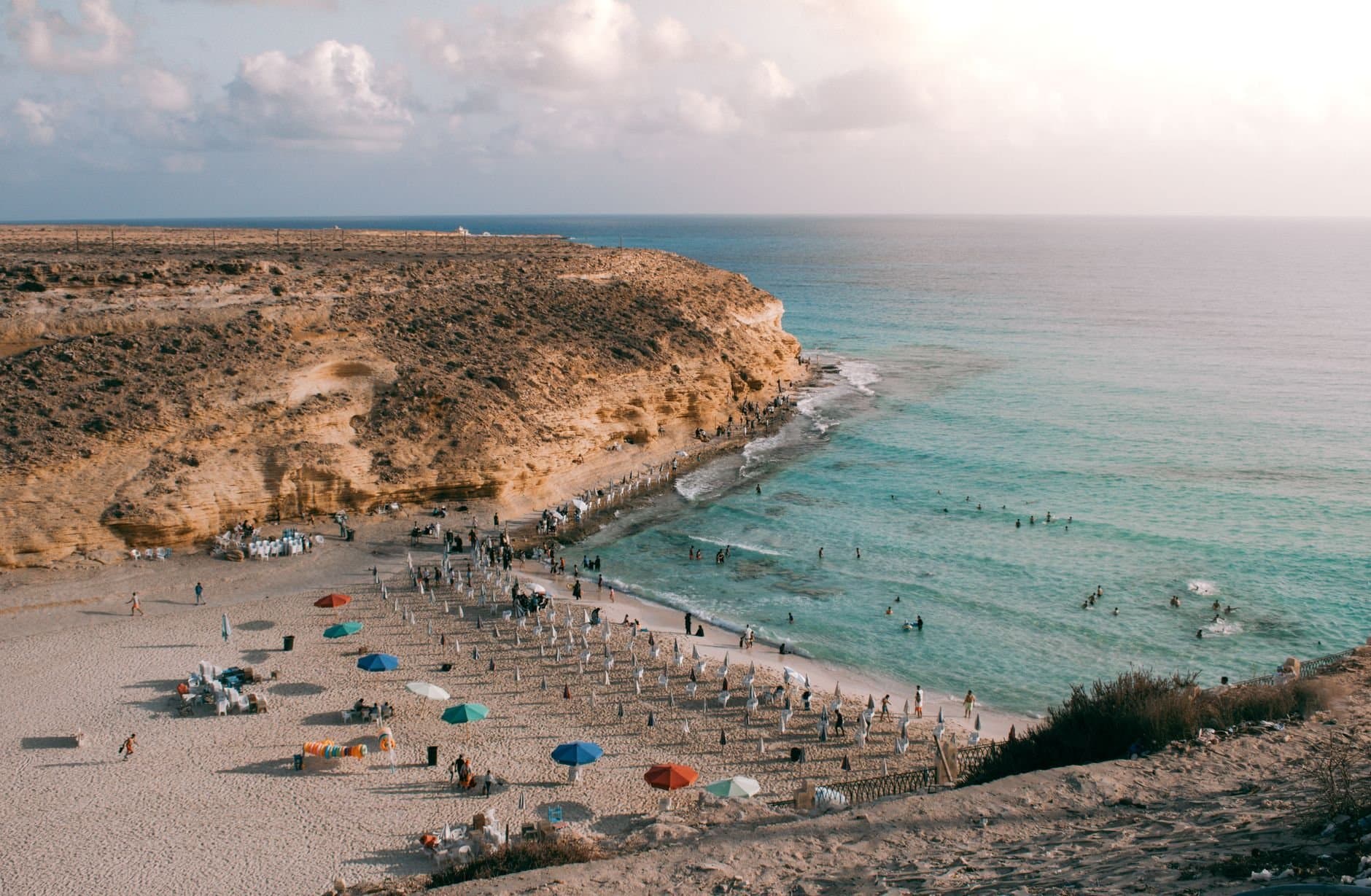 Explore the stunning coastline of Marsa Matruh with its golden cliffs and turquoise waters.
