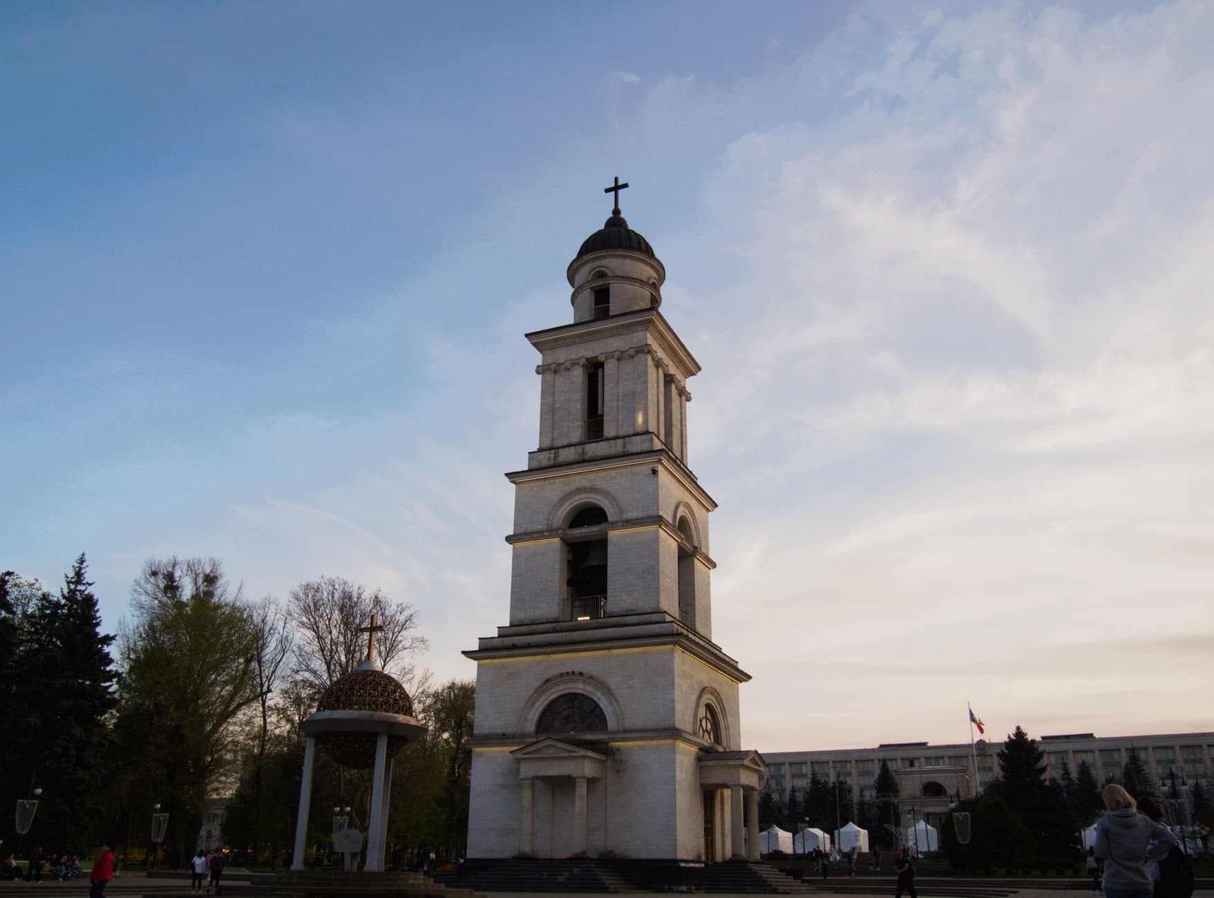 The iconic bell tower in Chișinău's Cathedral Park during a tranquil sunset evening.