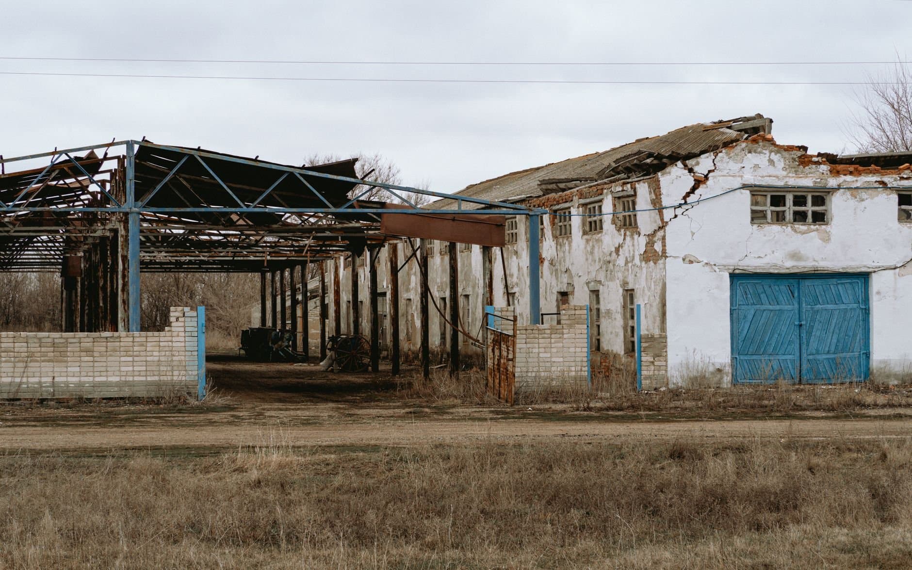 Rustic abandoned farmhouse with broken walls in rural Семенной, Saratov Oblast, Russia.