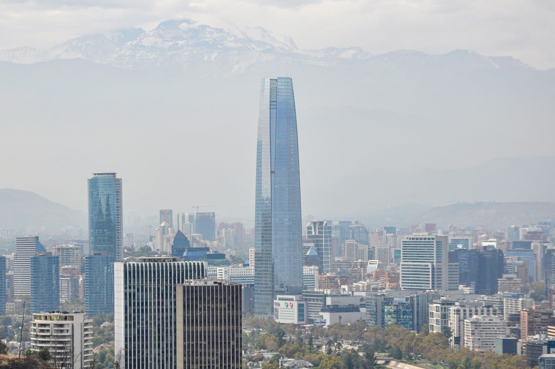 A panoramic view of Santiago's skyline featuring the majestic Sky Costanera Tower.