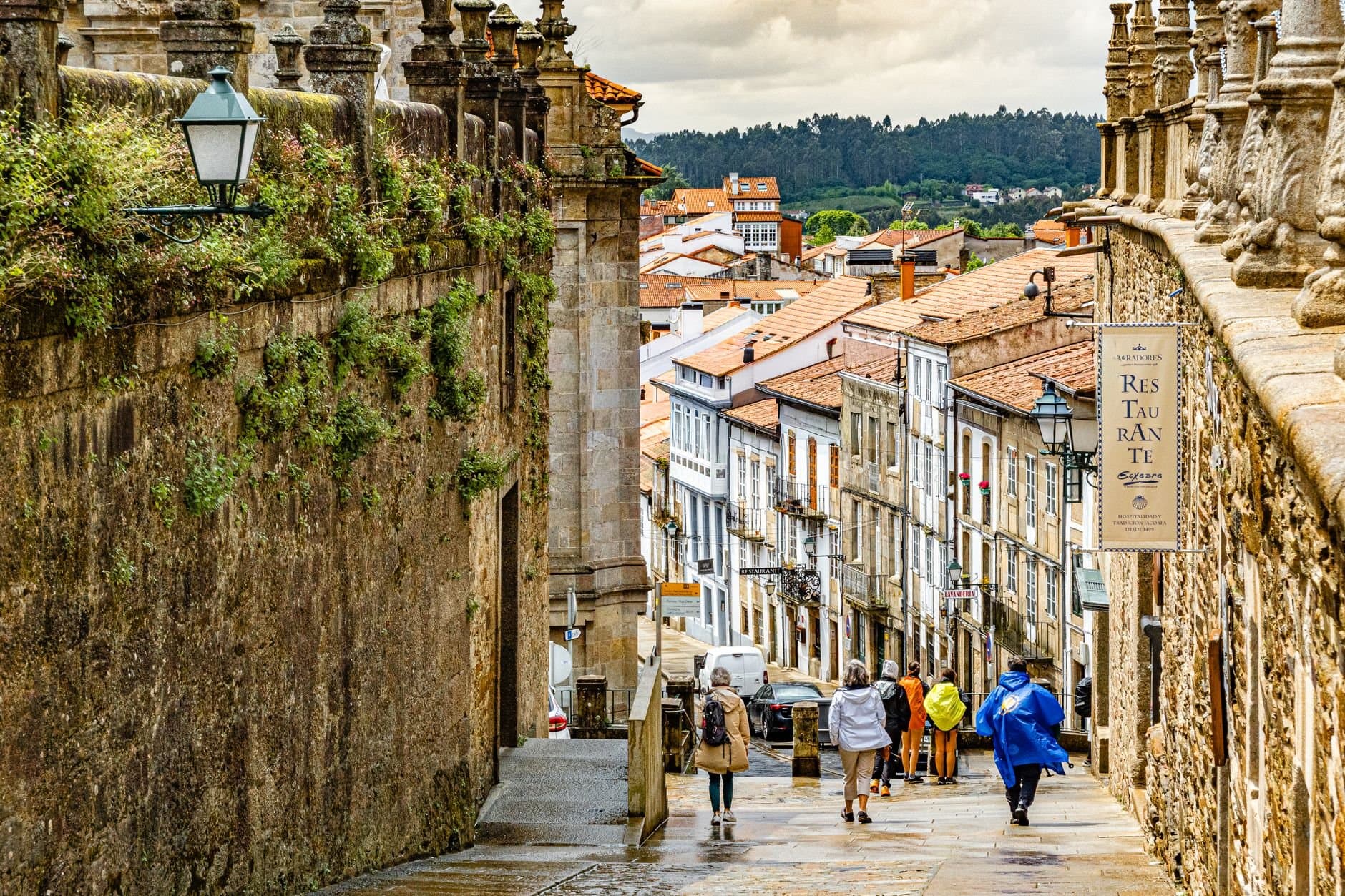 A vibrant and charming street in a historic European town, bustling with people and character.