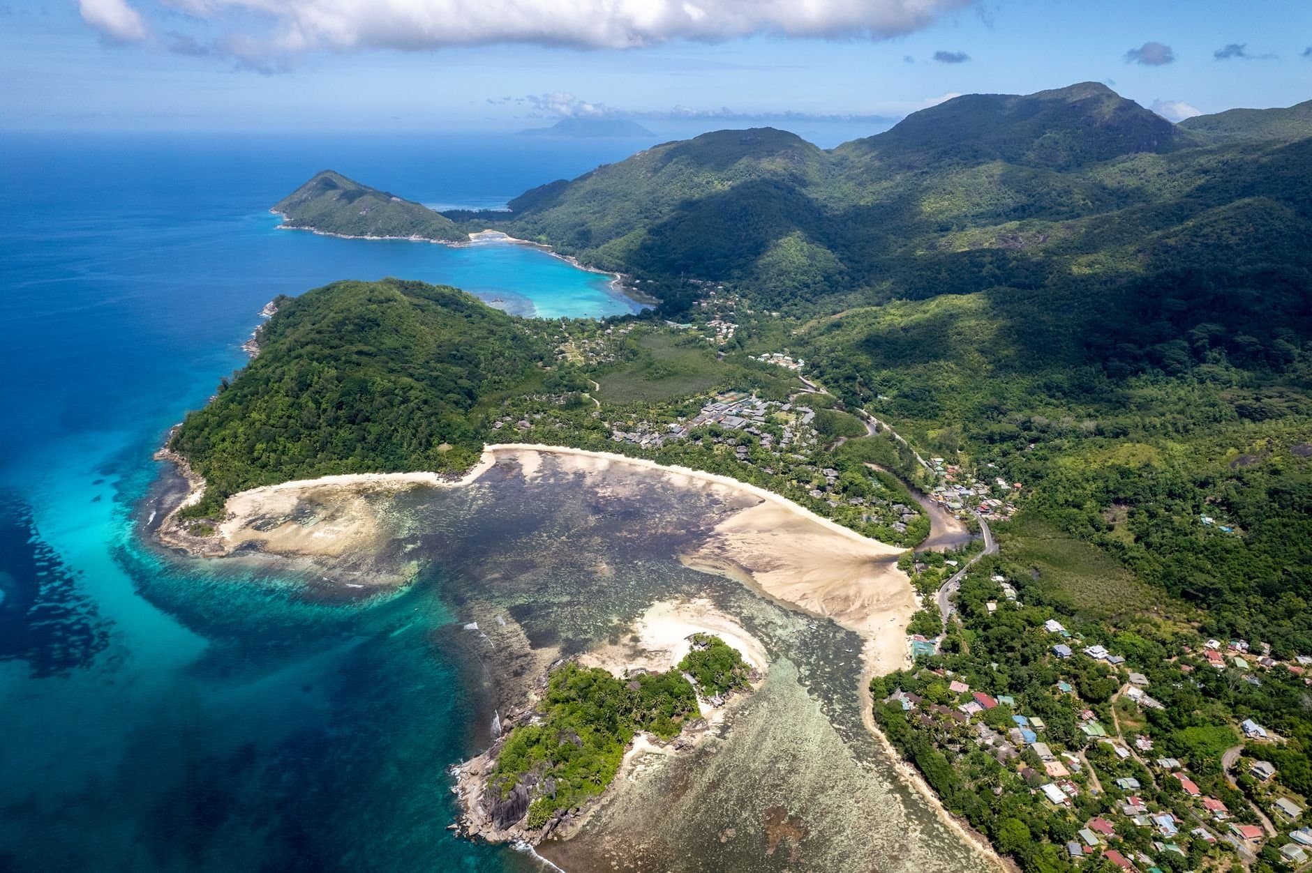 A breathtaking aerial view of Mahe Island's pristine coastline and lush landscapes in Seychelles.
