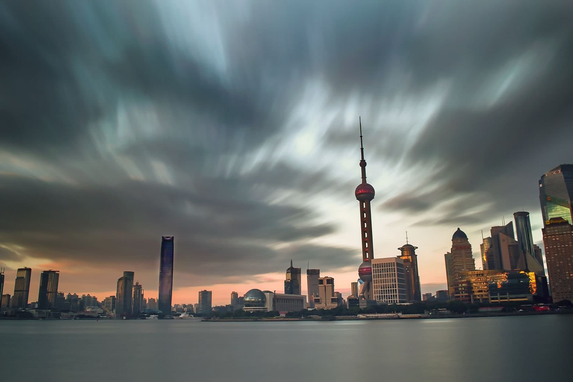 Stunning view of Shanghai skyline at dusk with the iconic Oriental Pearl Tower prominently featured.