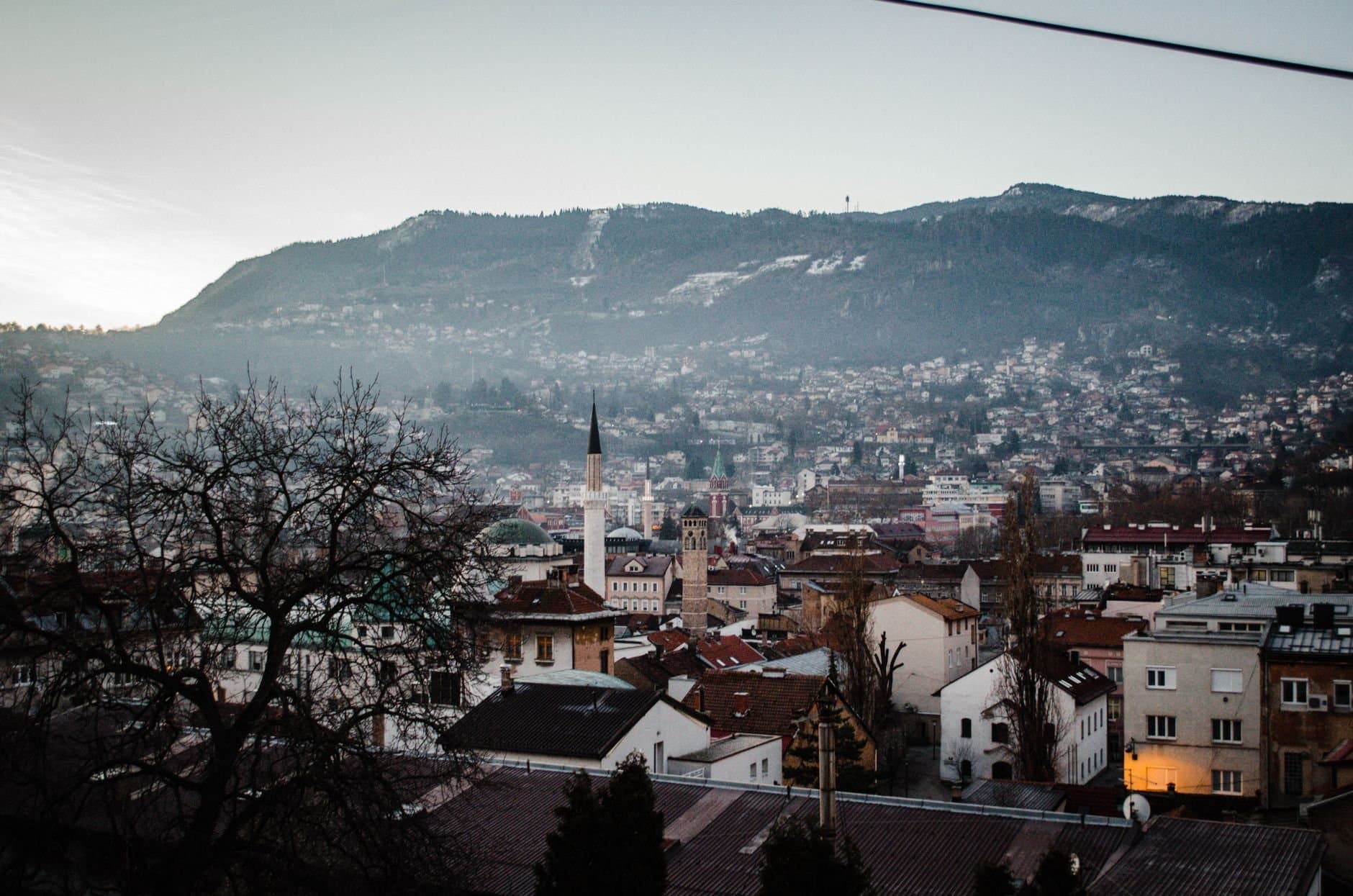 Beautiful view of Sarajevo city with mountains in the background during the day.
