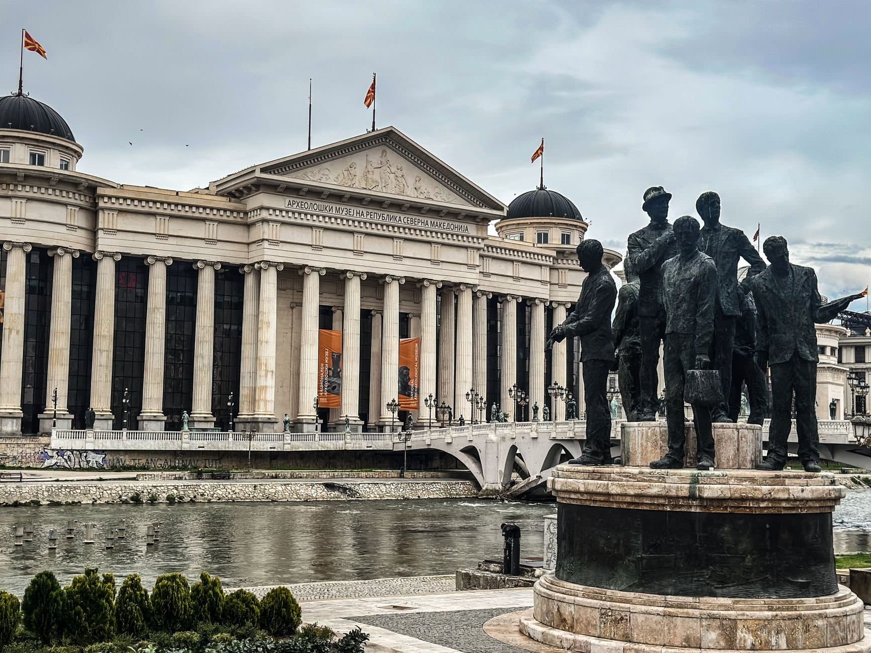 View of the Archaeological Museum and historic statues in Skopje, North Macedonia.