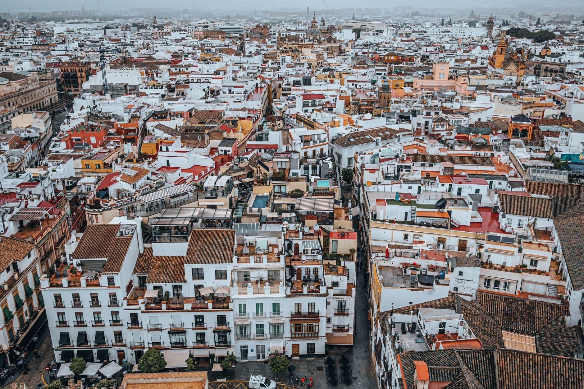 Explore the charming and colorful cityscape of Seville, Spain from above.