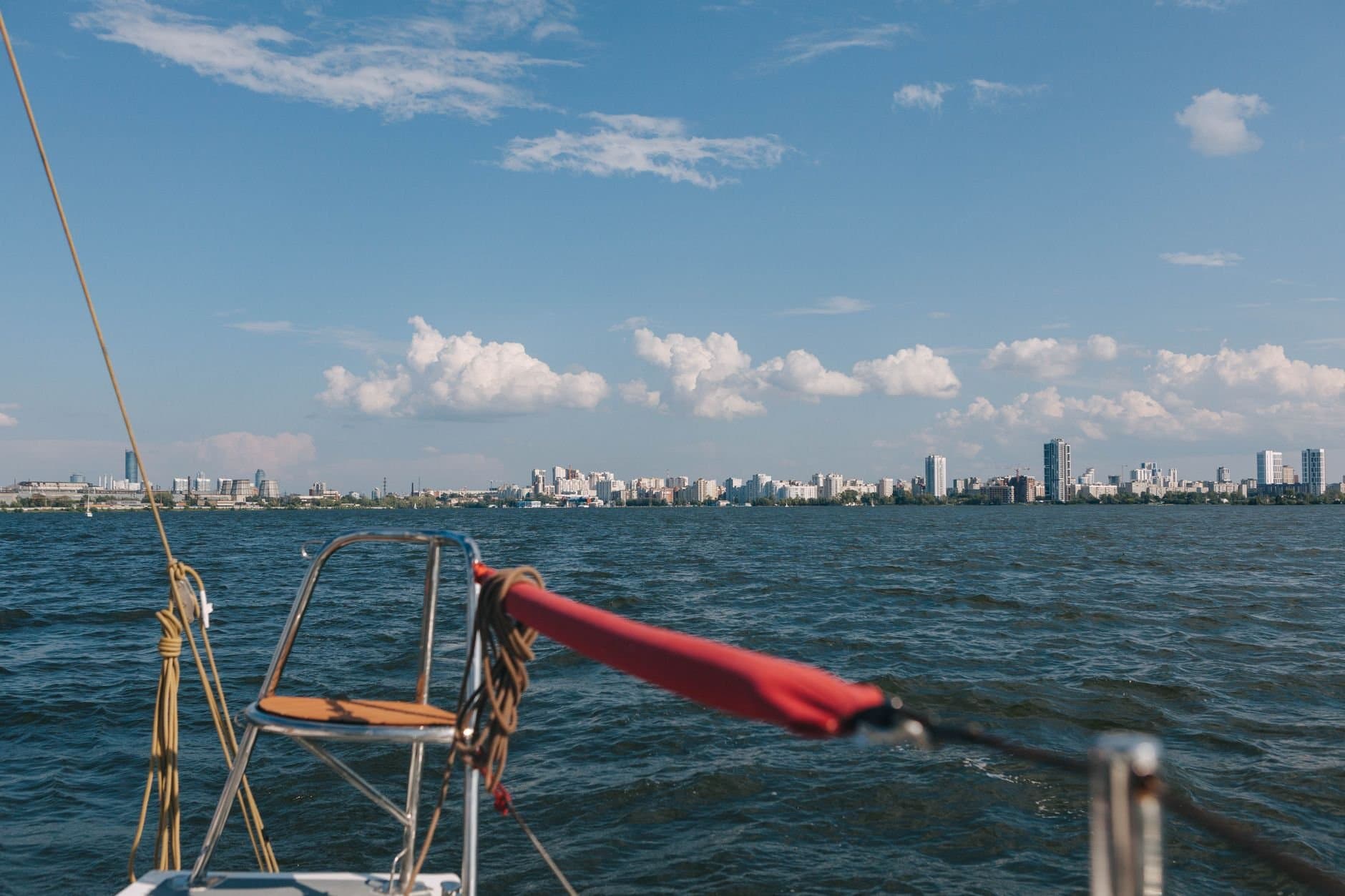 Explore the beautiful skyline of Yekaterinburg, Russia from a sailboat on a clear, sunny day.
