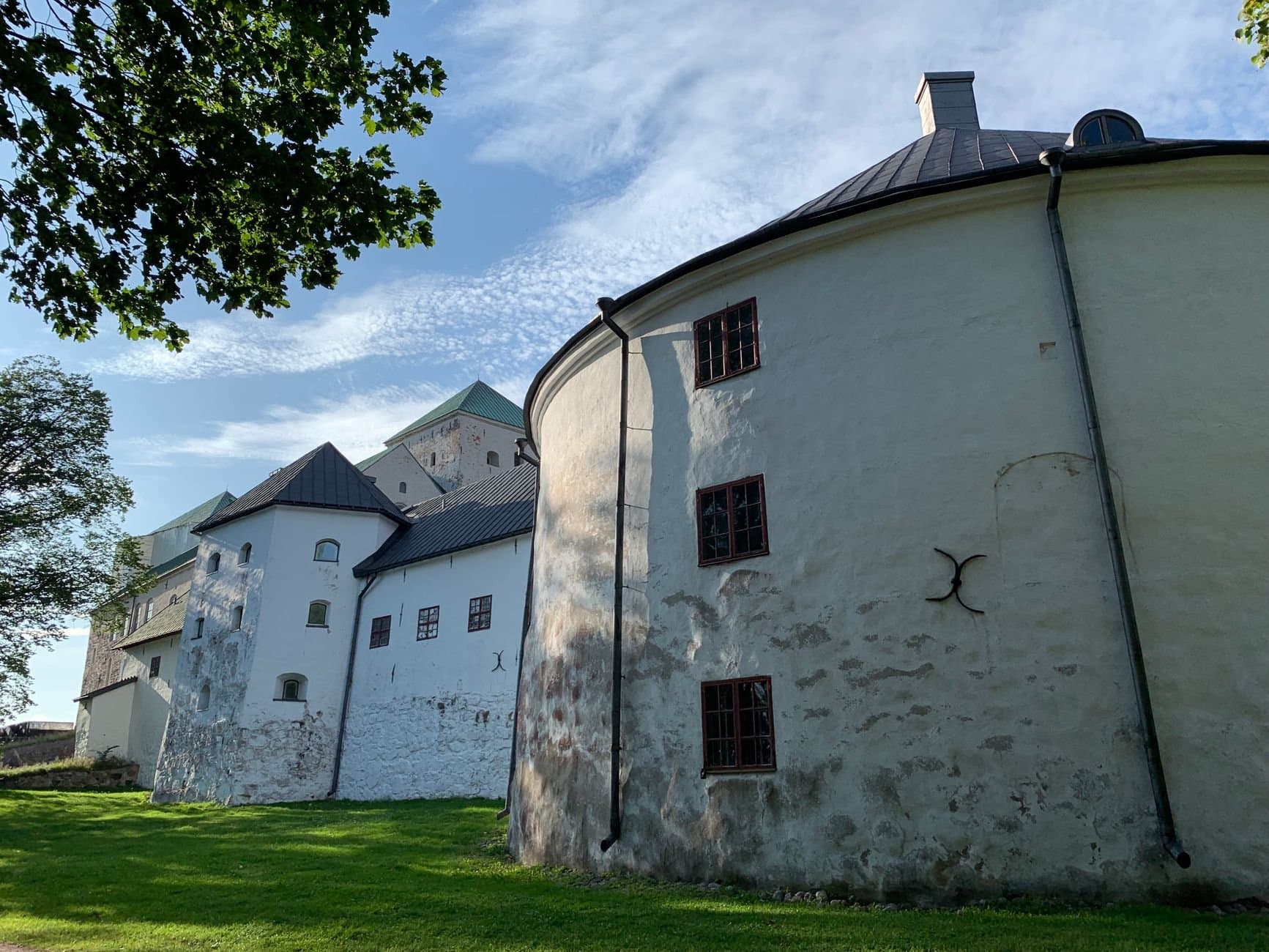 Turku Castle's medieval architecture captured on a bright summer day in Finland.