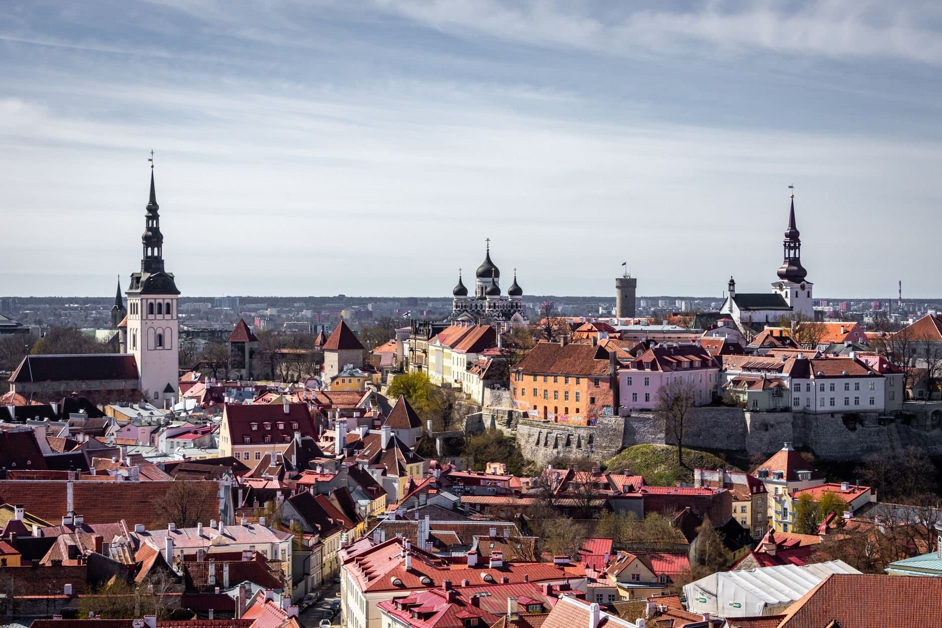Scenic aerial view of Tallinn's old town with historic towers and rooftops.