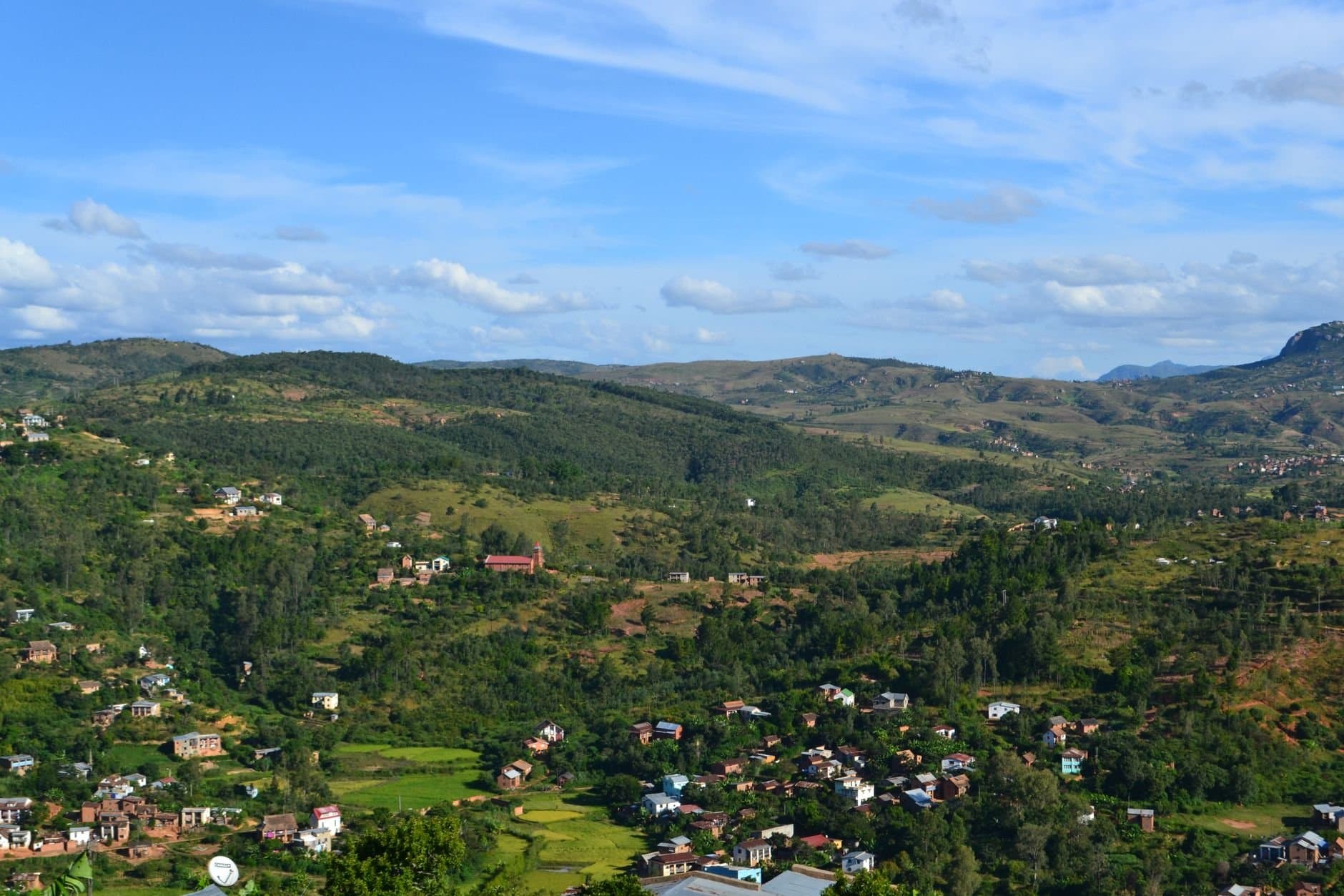 Breathtaking aerial view of Fianarantsoa's lush highlands, showcasing rural landscapes and rolling hills in Madagascar.