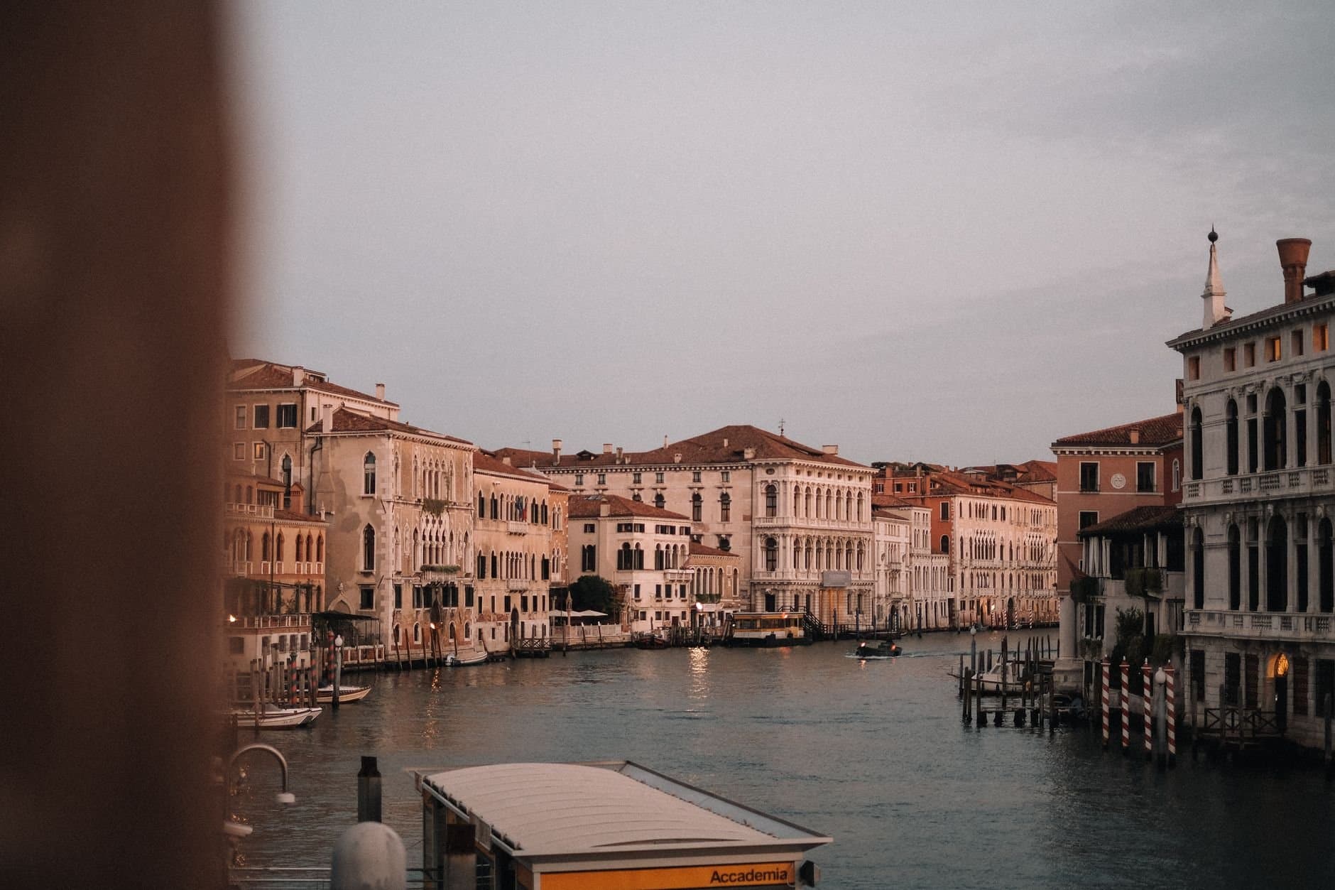 Explore the timeless beauty of Venice's historic canals and architecture at twilight.