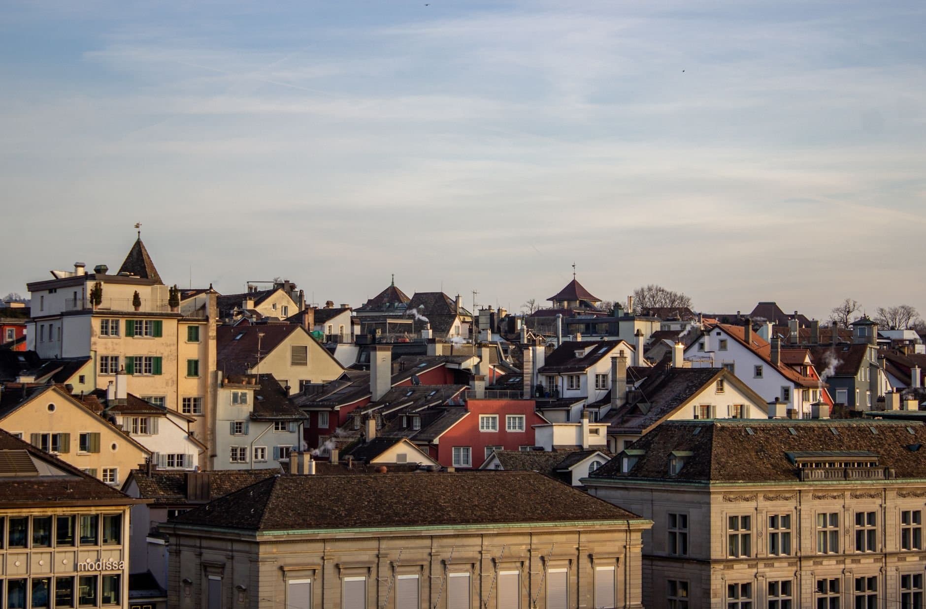 A picturesque view of the historic rooftops in Zurich, Switzerland, captured on a clear day.