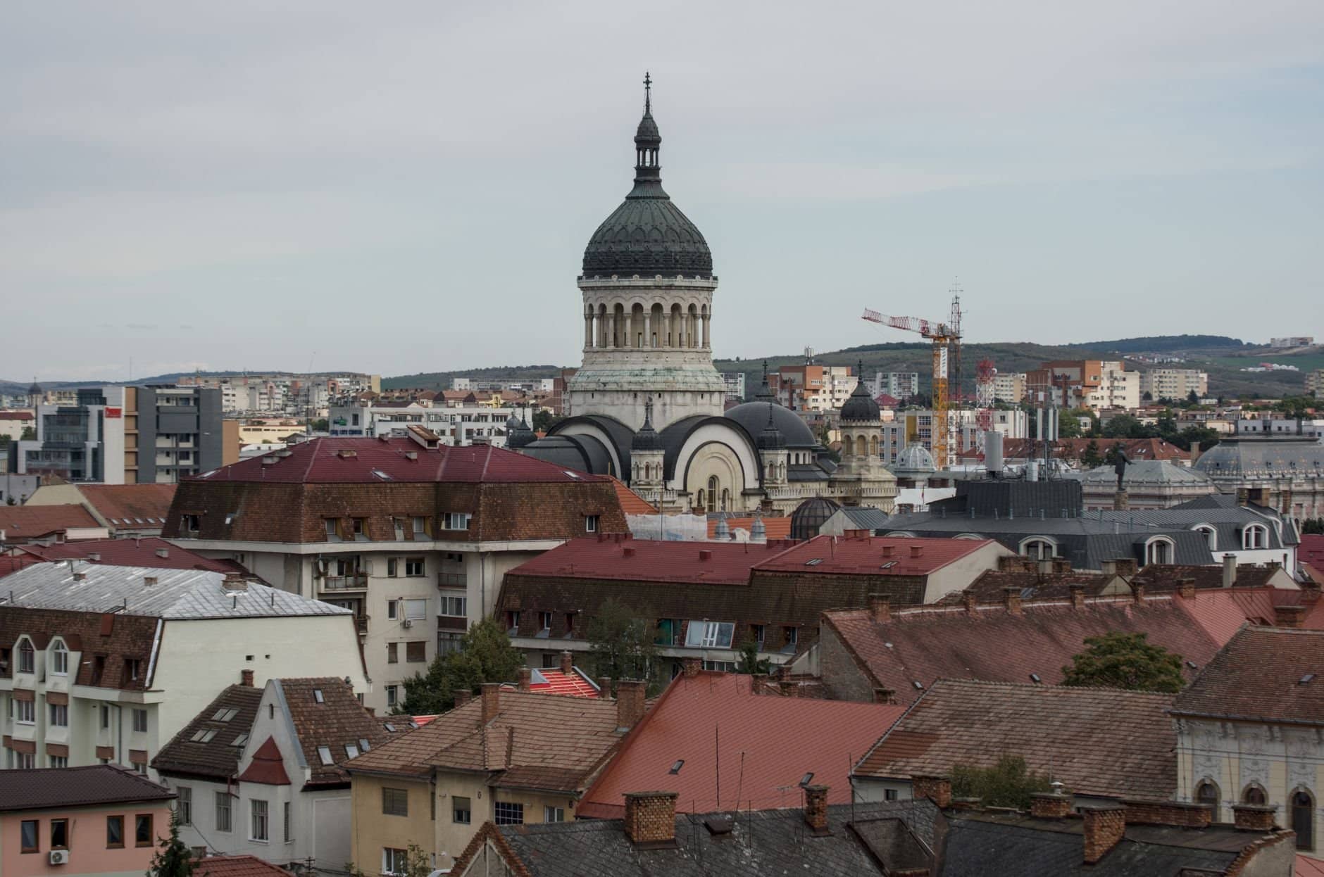 A scenic view of Cluj-Napoca's cityscape featuring the Metropolitan Cathedral.
