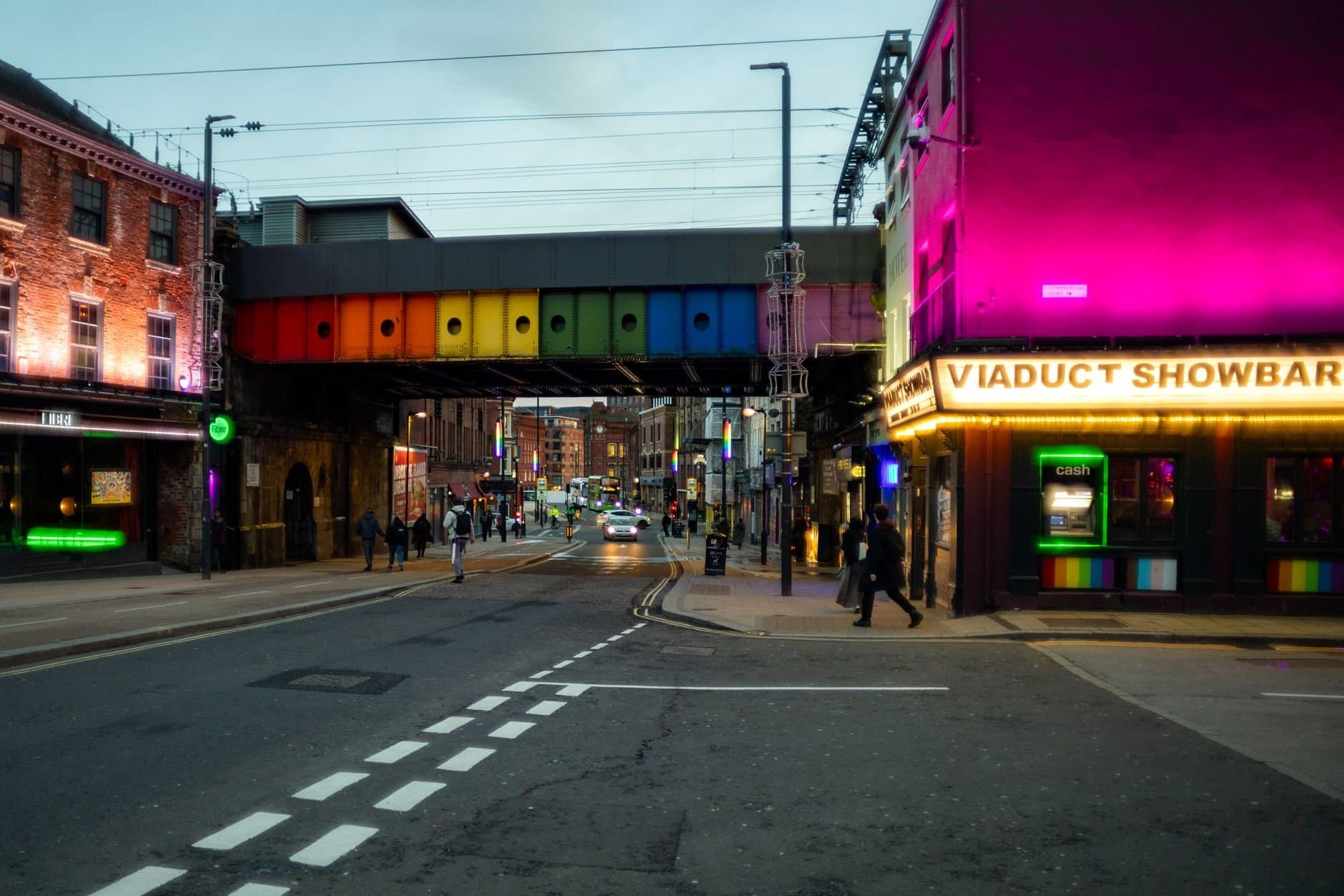 Colorful street with neon lights and nightlife vibes in Leeds, UK.